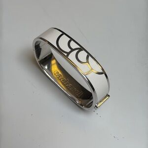 Cacharel White Enamel silver tone Bangle EUC slide lock up to open